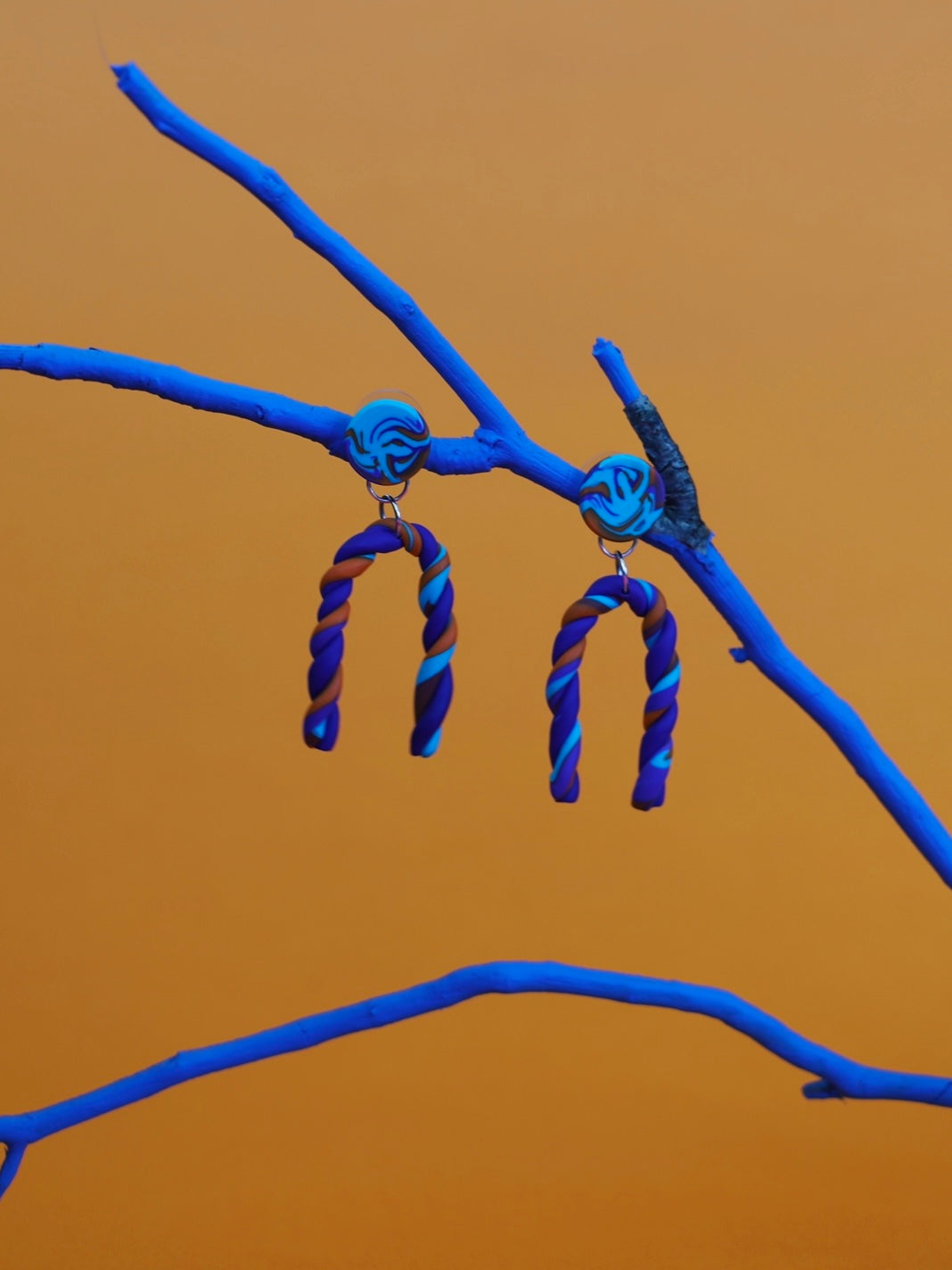 Violet orange twisted earrings